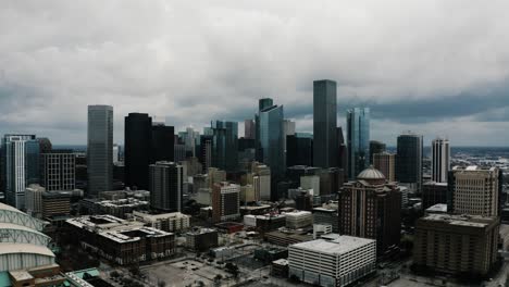 aerial shot pulling away from houston's downtown skyscrapers