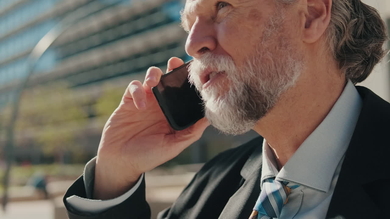 Happy Businessman Has Pleasant Phone Conversation