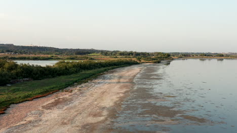 Aerial-drone-footage,-pond-beach-near-Montpellier,-France