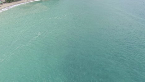 Beautiful-scenery-view-of-Puerto-Galera-Island-white-sandy-beach-and-top-shot-towards-the-turquoise-tranquil-sea-water