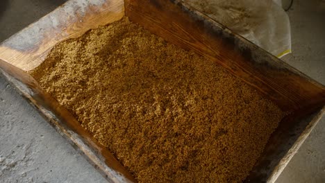 wheat grains are soaked in a wooden bucket and prepared to become bulgur used in bulgur rice, a turkish food.