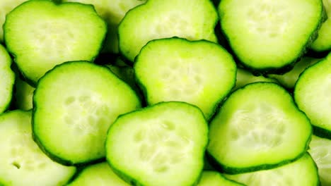 slice fresh green cucumber. amazing vegetarian macro background with vibrant texture