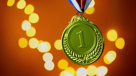 gold medal on orange background