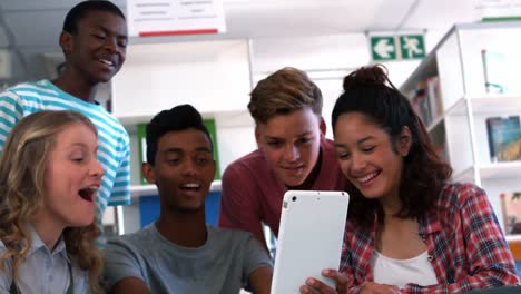 students using digital tablet in classroom