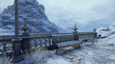 a tranquil winter view shows a solitary bench beside a stone railing