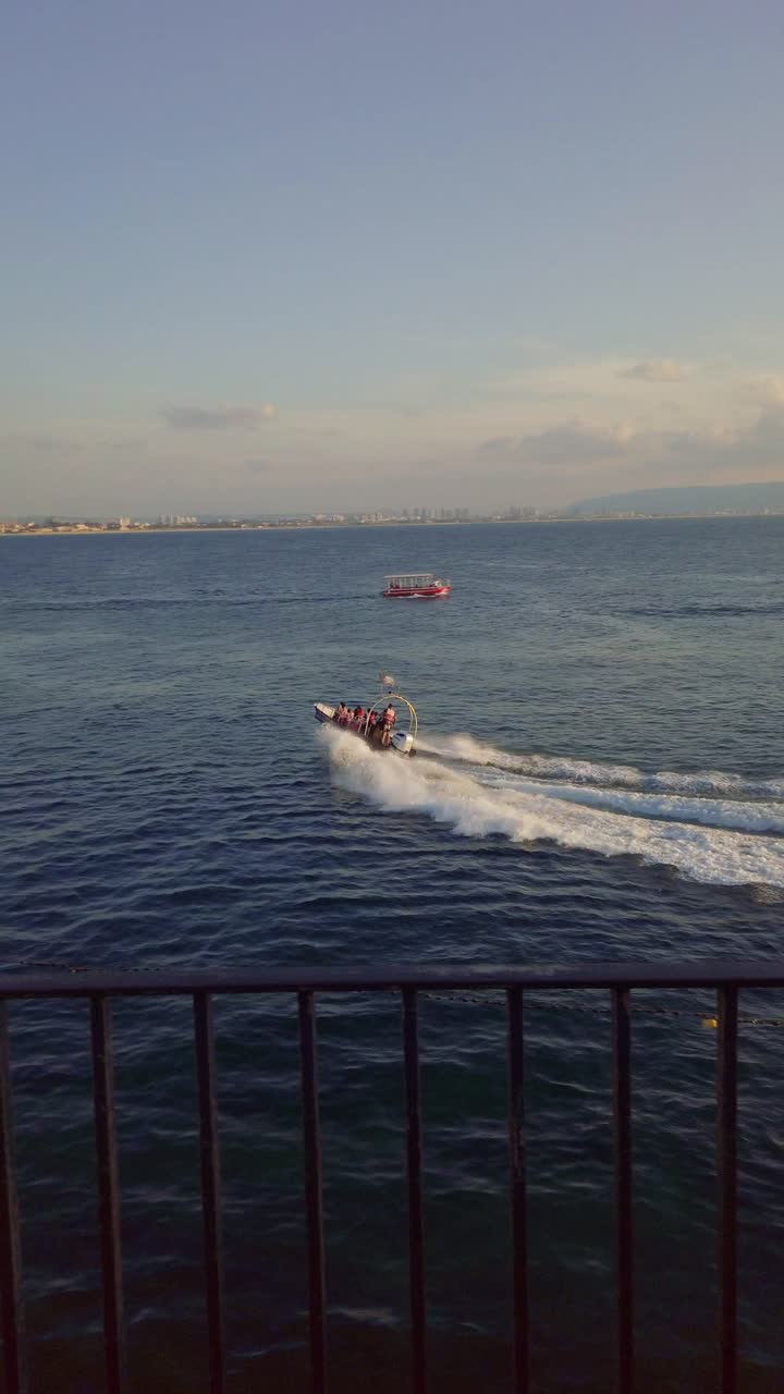 Speedboat turning in the Mediterranean sea near Acre old city, Israel