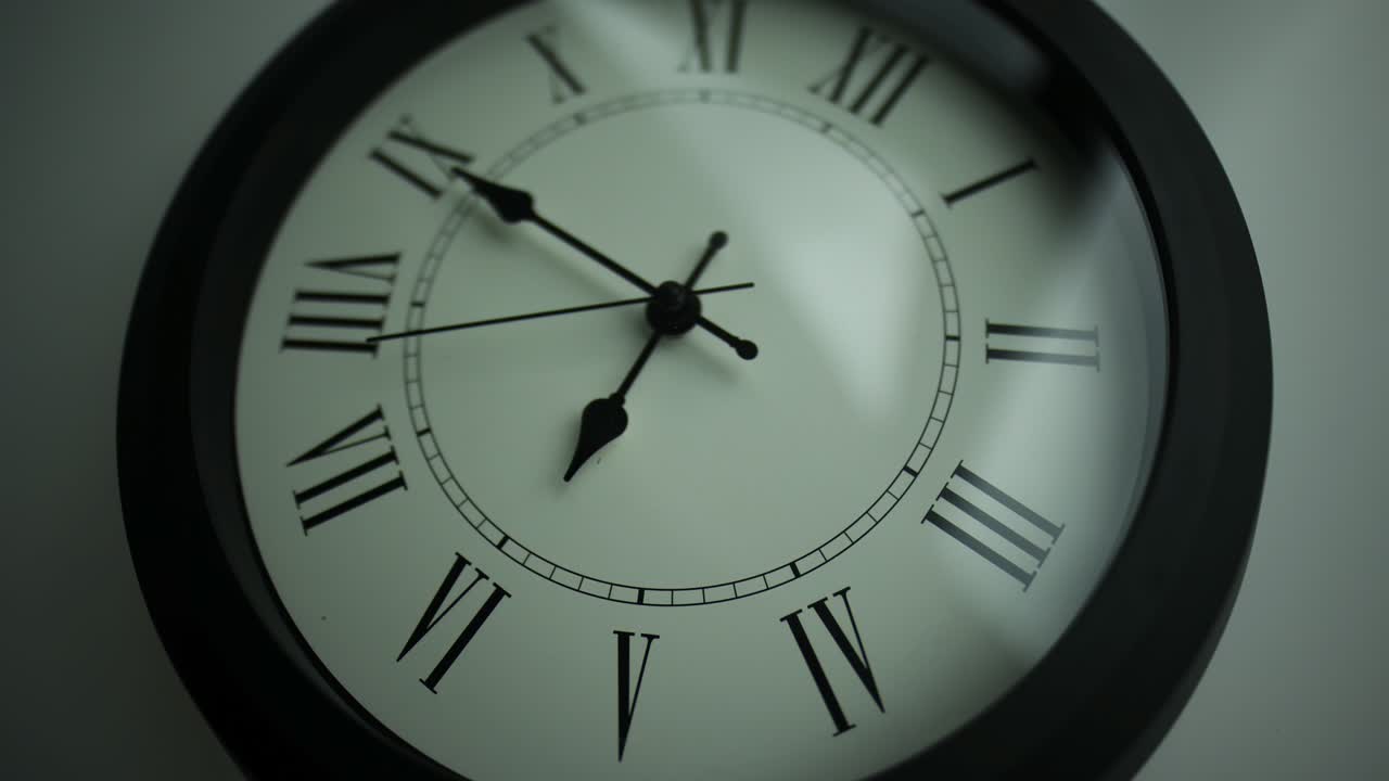 Close-up time lapse of a  old-fashioned antiquated wall clock with roman numerals