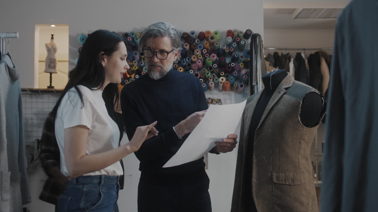 Fashion Designers Discussing a Design