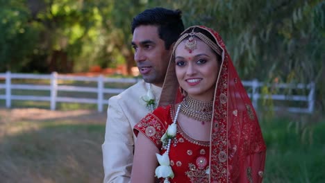 Indian-Bride-And-Groom-Looking-At-Camera---Close-Up