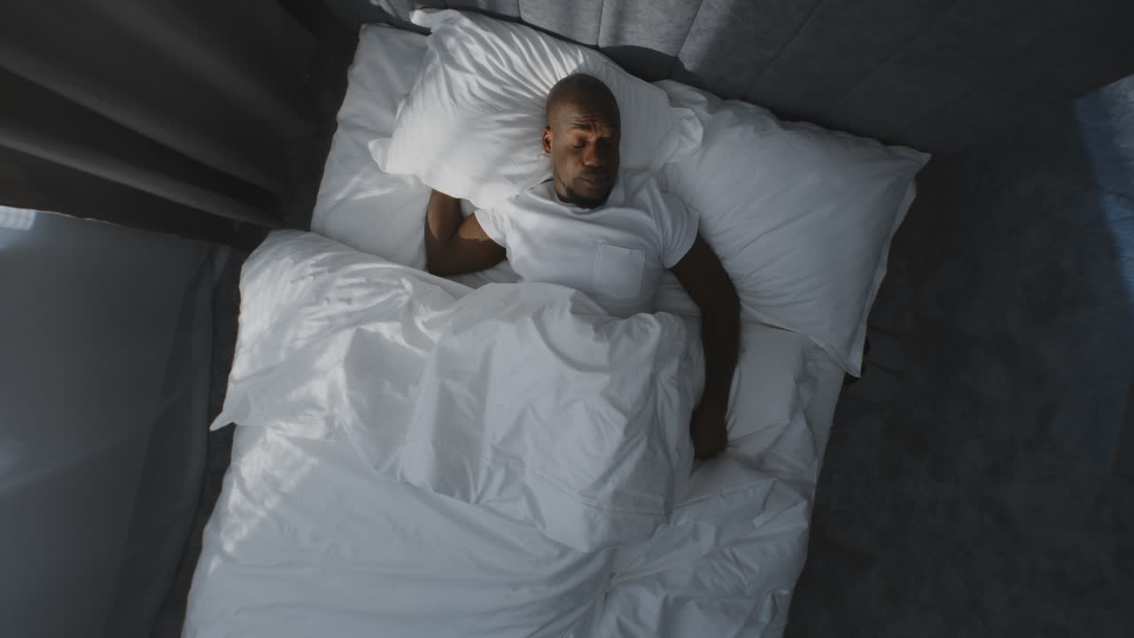 Man sleeping in bed