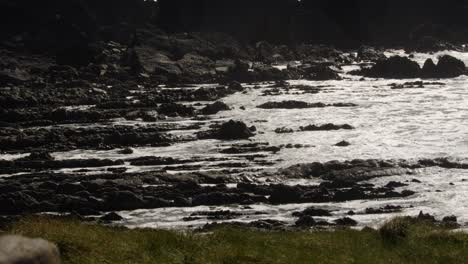 long shot of waves rolling onto sedimentary rocks at hartland quay, stoke, hartland, bideford