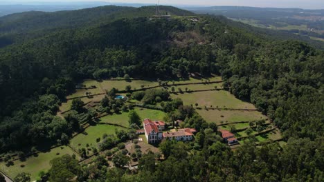 aerial - convento do calvário do bom jesus da franqueira, nestled in lush forested hills. barcelos, portugal