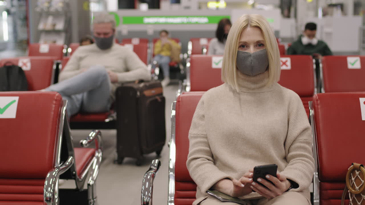 Woman In Mask In Departure Lounge