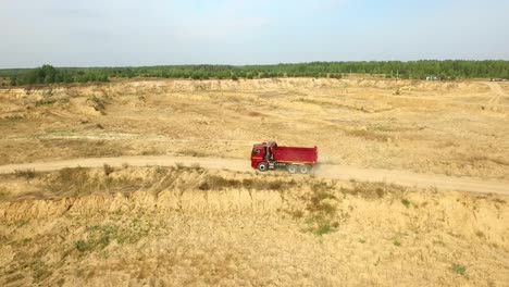 red dump truck in a quarry