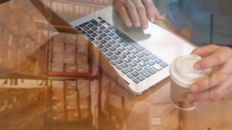 animation of man using laptop over warehouse in background