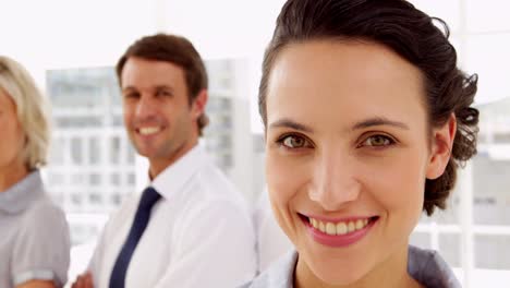 business people smiling at the camera