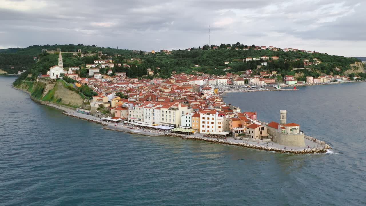 High aerial approaching view of peninsula and village of Piran, Slovenia