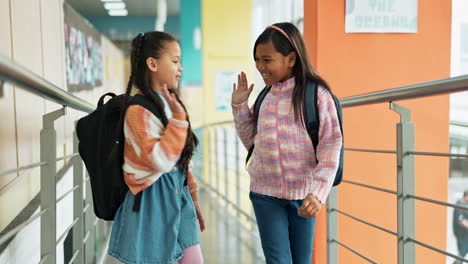 two young girls in a school hallway