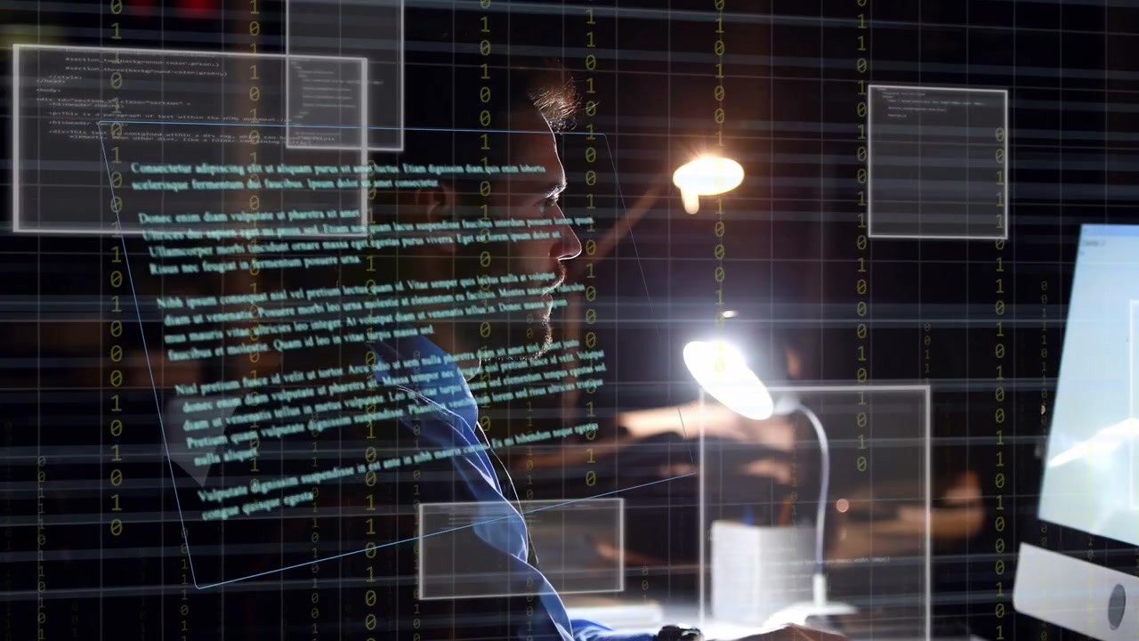 Man Working on Computer with Holographic Data Overlay