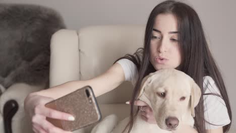 a beautiful brunette takes selfies with her amazing labrador