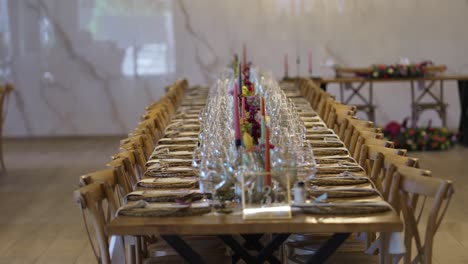 long wedding banquet table with glassware flowers and candles location irrelevant