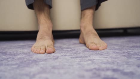 Close-up-of-male-feet-waking-up.-To-wake-up.-Happy-waking-up.