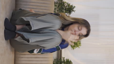 vertical video of young woman with fear and stress.