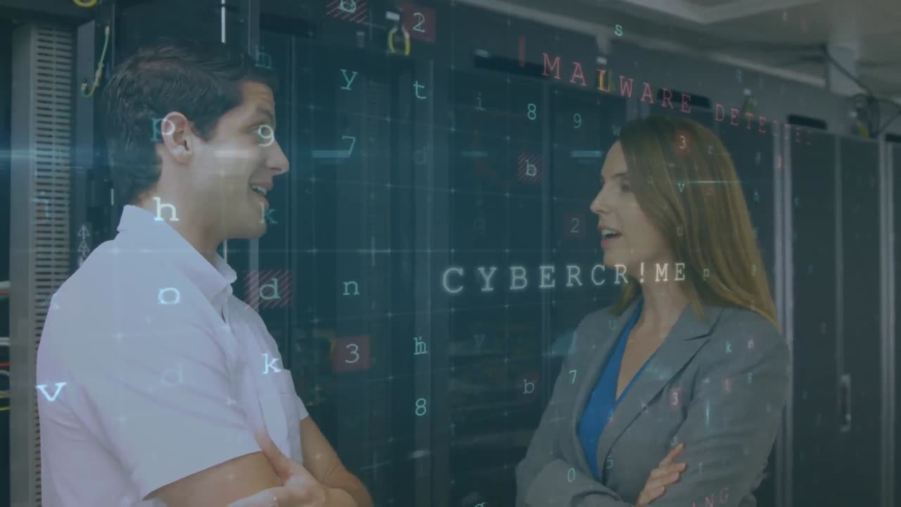 Man and woman talking in server room with moving security messages