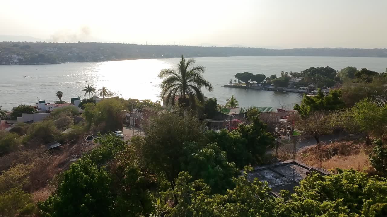 Serene aerial view of Laguna Tequesquitengo with lush greenery and tranquil waters