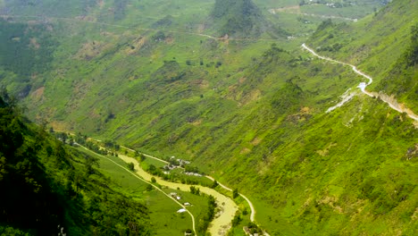 Drone-footage-of-yellow-muddy-river-in-a-Vietnamese-jungle-canyon