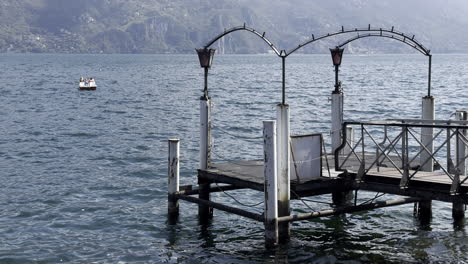 Lake-landscape-with-tourists-having-fun-on-a-pedal-boat