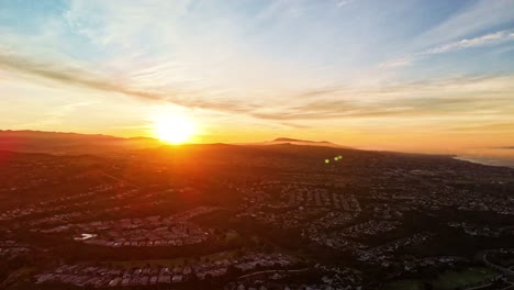 aerial hyperlapse of beautiful sunrise over california suburbs towards pacific ocean