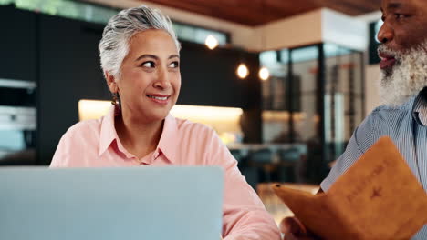 senior couple planning a trip online