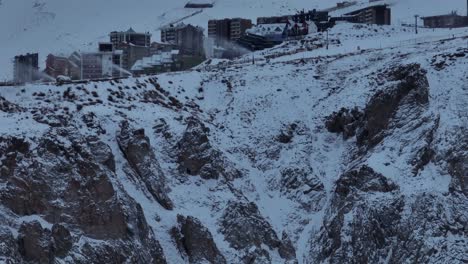 aerial rising shot establishing shot of the el colorado ski resort and mountainside