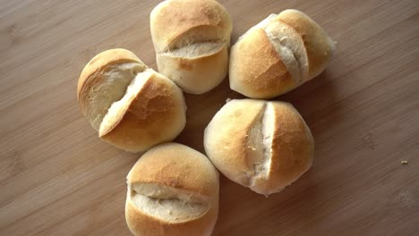 bread on wooden background rotates