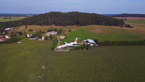 smooth aerial top view flight ii-62 airplane on ground