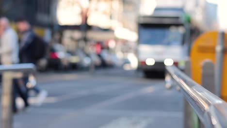 people crossing street, tram approaching