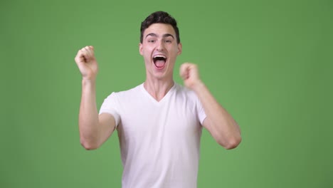 young handsome man looking excited