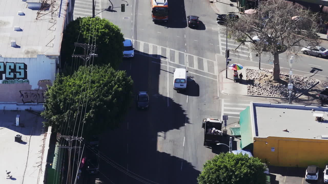 High-Angle View of an Urban Intersection with a Bus and Cars