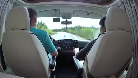 man driving on a road in the camper van rv