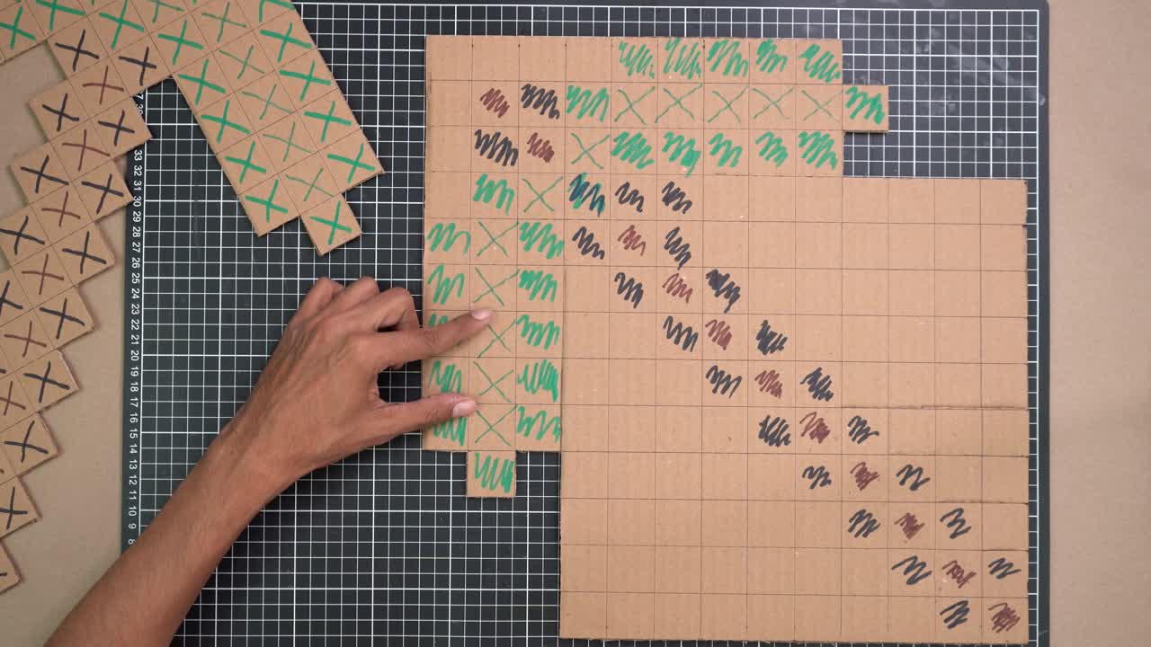 Hands crafting with cardboard, creativity and focus