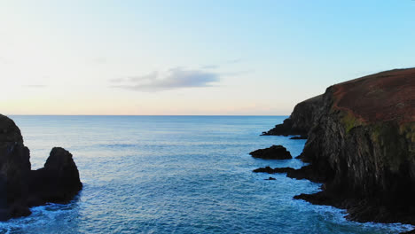 Rock-formation-in-sea-at-dusk-4k