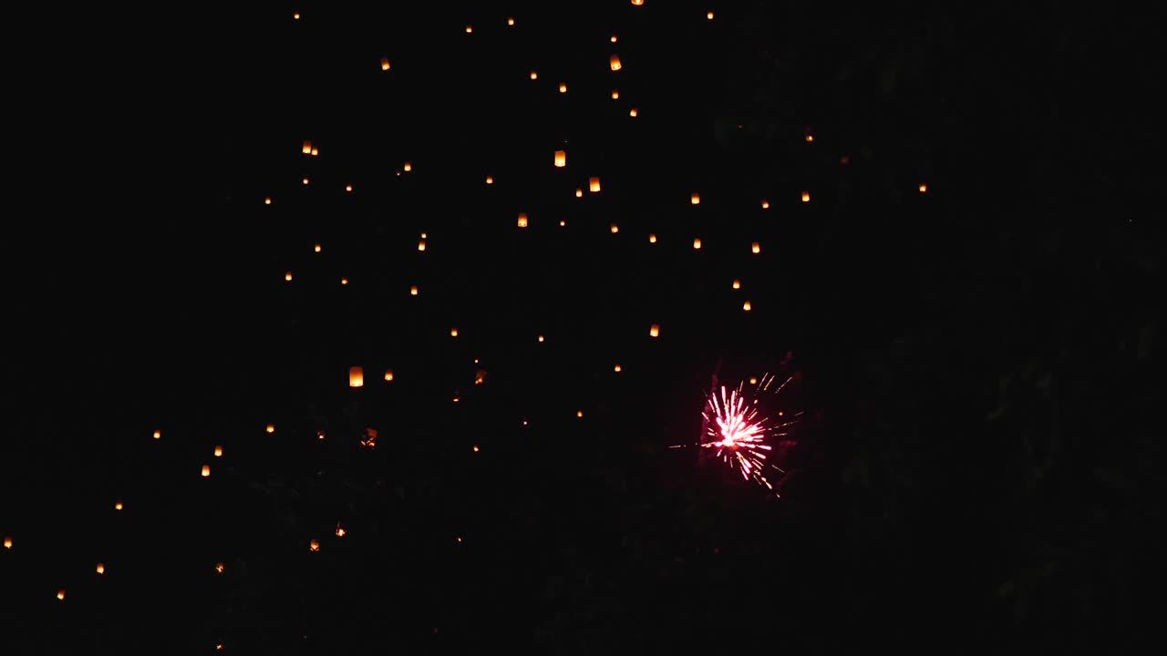 Sky Lanterns and Fireworks at Night