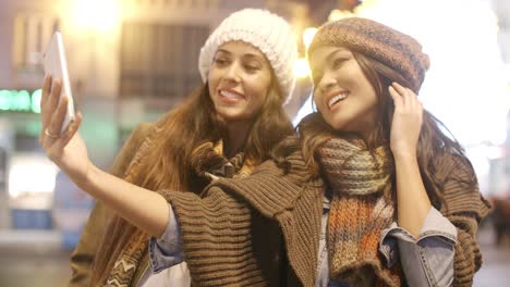 two vivacious women taking a selfie