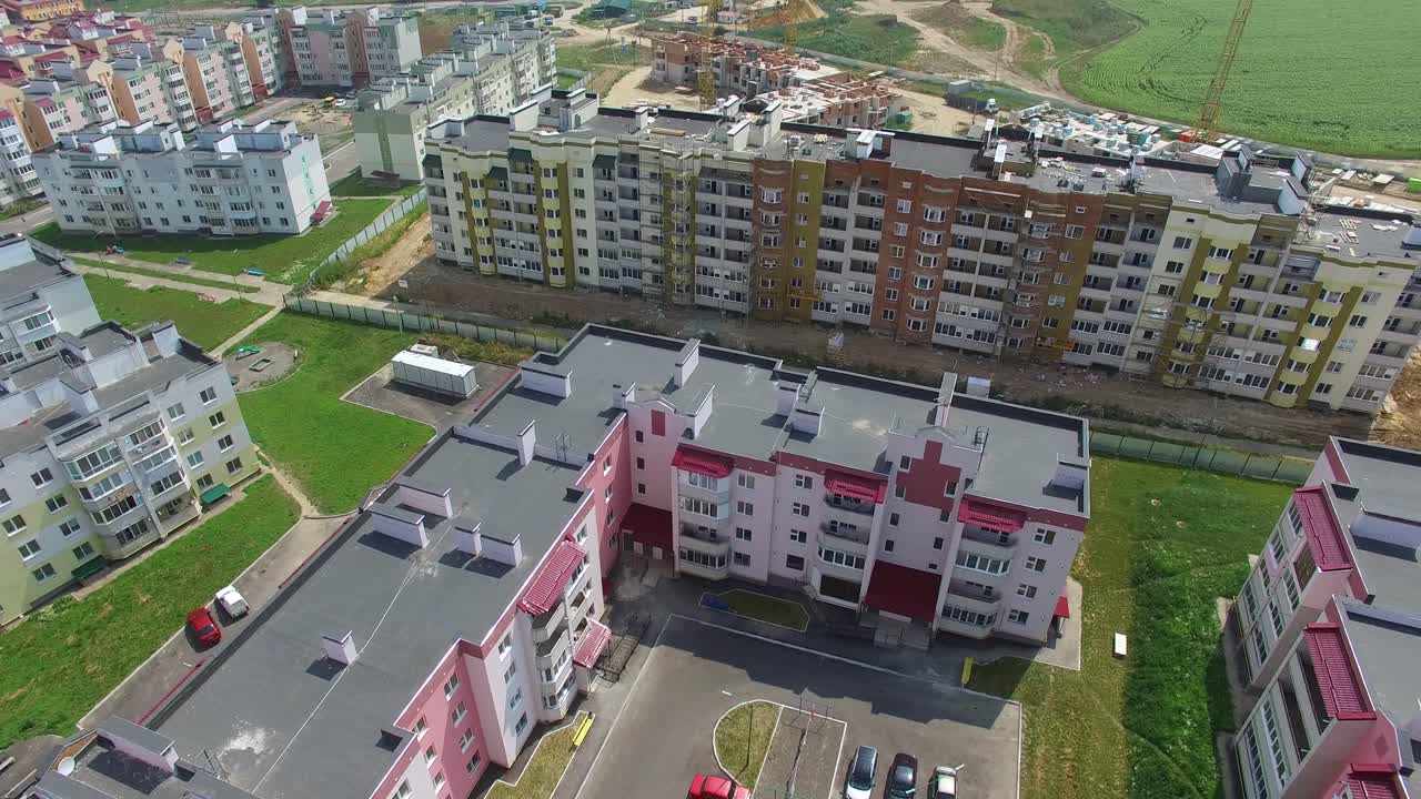 construction of modern high-rise buildings near the new buildings in the city. Aerial view