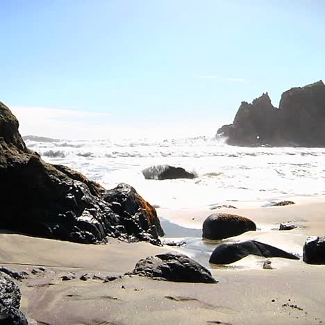 Waves-roll-into-shore-on-a-sunny-day-along-California-coastline-2