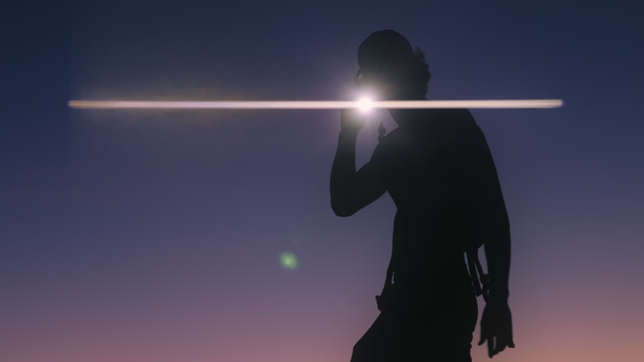Man explores mountain top after sunset with flashlight. Shot on Canon R5 at 4k 24fps with RF 70-200mm f2.8 and chromatic flare fx filter.