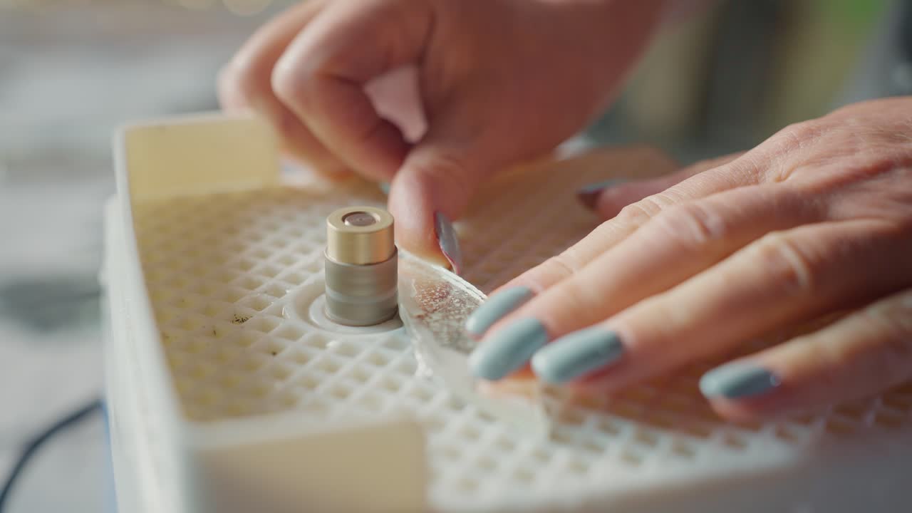Woman repairing or crafting with a glass polishing machine