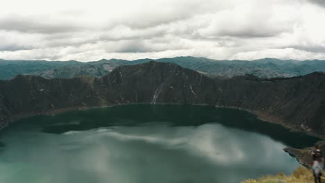 aerial view of the quilotoa lake in the crater of the volcano in ecuador - drone shot