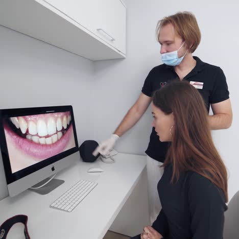 woman looking at her teeth